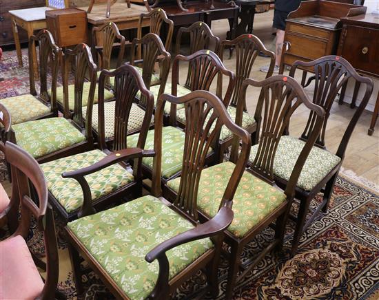 A set of twelve Hepplewhite style mahogany dining chairs, four George III period